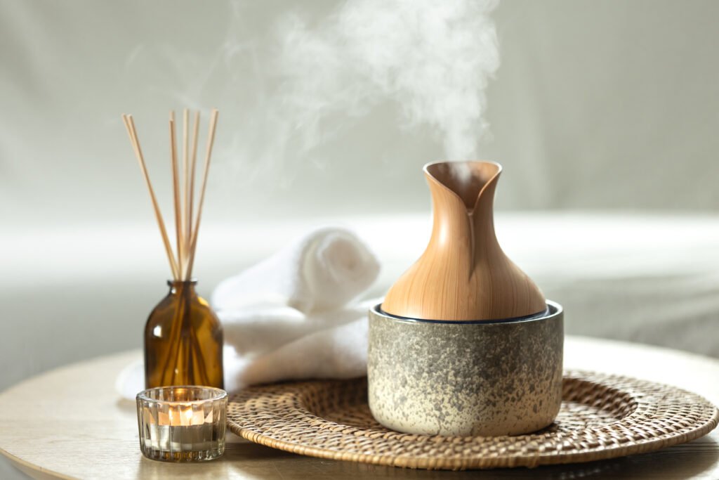 aroma oil diffuser lamp with the sticks perfume and candle.